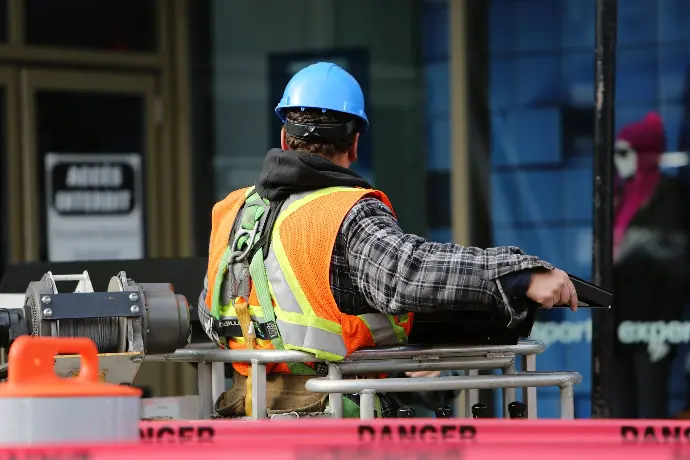 Window and door installer worker wearing protection equipment