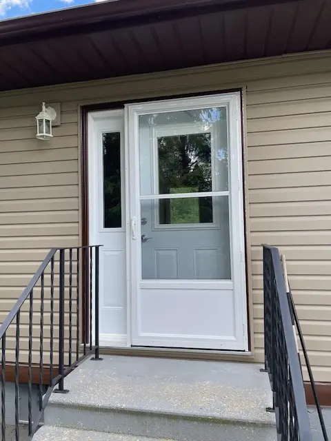 Self Storing Storm Door, White Aluminum Storm Door, Fort Frances, Kenora, Dryden, Sioux Lookout, Ontario, Canada, Northwestern Ontario