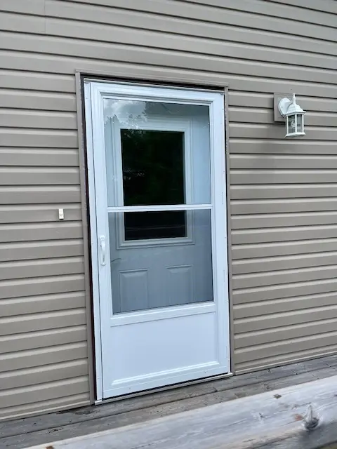 Self Storing Storm Door, White Aluminum Storm Door, Fort Frances, Kenora, Dryden, Sioux Lookout, Ontario, Canada, Northwestern Ontario