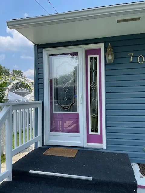 Self Storing Storm Door, White Aluminum Storm Door, Fort Frances, Kenora, Dryden, Sioux Lookout, Ontario, Canada, Northwestern Ontario