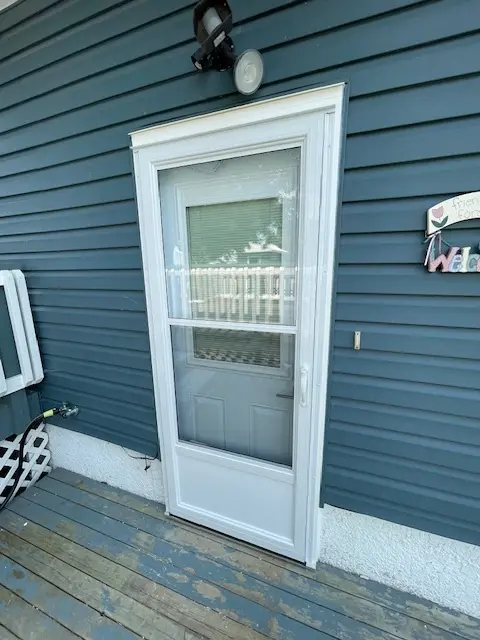 Self Storing Storm Door, White Aluminum Storm Door, Fort Frances, Kenora, Dryden, Sioux Lookout, Ontario, Canada, Northwestern Ontario