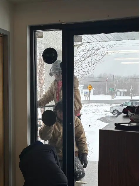 Installers working on commercial windows installation