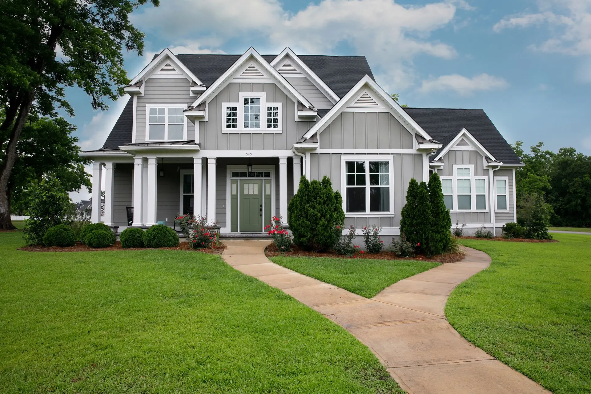 Front view of a modern house with energy-efficient windows and entry door