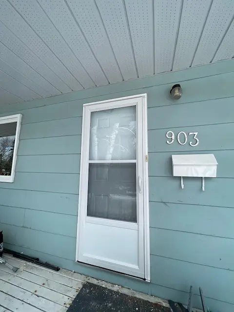 Self Storing Storm Door, White Aluminum Storm Door, Fort Frances, Kenora, Dryden, Sioux Lookout, Ontario, Canada, Northwestern Ontario