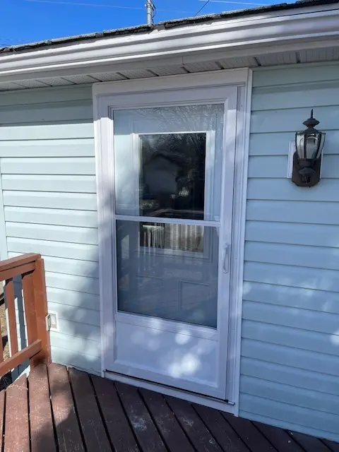 Self Storing Storm Door, White Aluminum Storm Door, Fort Frances, Kenora, Dryden, Sioux Lookout, Ontario, Canada, Northwestern Ontario